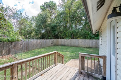 This beautifully updated and recently renovated 3-bedroom on Diamondhead Country Club in Mississippi - for sale on GolfHomes.com, golf home, golf lot