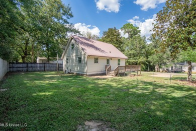 This beautifully updated and recently renovated 3-bedroom on Diamondhead Country Club in Mississippi - for sale on GolfHomes.com, golf home, golf lot