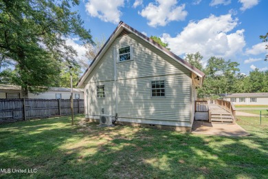 This beautifully updated and recently renovated 3-bedroom on Diamondhead Country Club in Mississippi - for sale on GolfHomes.com, golf home, golf lot