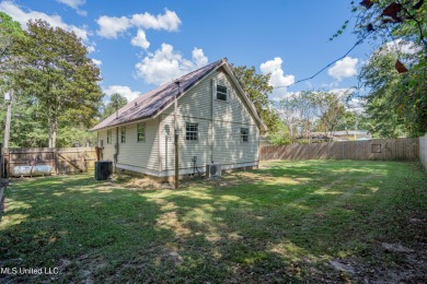 This beautifully updated and recently renovated 3-bedroom on Diamondhead Country Club in Mississippi - for sale on GolfHomes.com, golf home, golf lot