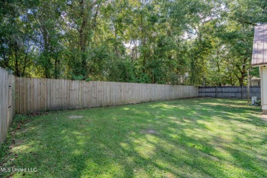 This beautifully updated and recently renovated 3-bedroom on Diamondhead Country Club in Mississippi - for sale on GolfHomes.com, golf home, golf lot