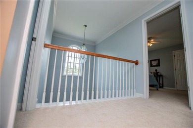 Welcome home! Step inside from the inviting wrap-around front on Creekside Golf and Country Club in Georgia - for sale on GolfHomes.com, golf home, golf lot