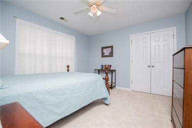 Welcome home! Step inside from the inviting wrap-around front on Creekside Golf and Country Club in Georgia - for sale on GolfHomes.com, golf home, golf lot