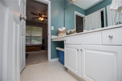 Welcome home! Step inside from the inviting wrap-around front on Creekside Golf and Country Club in Georgia - for sale on GolfHomes.com, golf home, golf lot