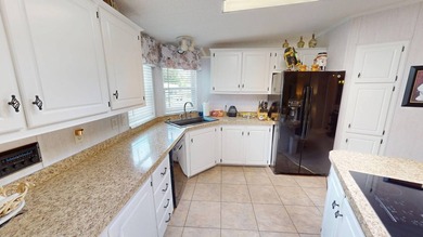 Welcome to this spacious double-wide manufactured home located on Highlands Ridge Golf Course - South in Florida - for sale on GolfHomes.com, golf home, golf lot