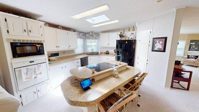 Welcome to this spacious double-wide manufactured home located on Highlands Ridge Golf Course - South in Florida - for sale on GolfHomes.com, golf home, golf lot