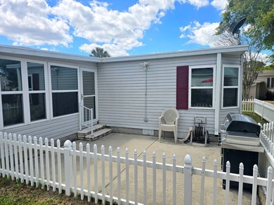 Welcome to this spacious double-wide manufactured home located on Highlands Ridge Golf Course - South in Florida - for sale on GolfHomes.com, golf home, golf lot