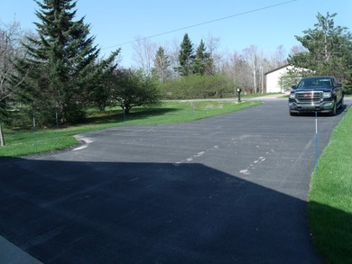 Pride of ownership is evident in this beautifully maintained on Wildwood Lakes in Michigan - for sale on GolfHomes.com, golf home, golf lot