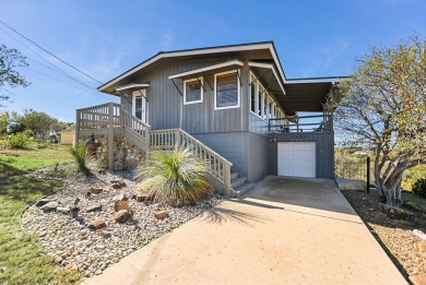 This beautiful hilltop home offers fantastic views of nearby on Apple Rock Golf Course - Horseshoe Bay in Texas - for sale on GolfHomes.com, golf home, golf lot