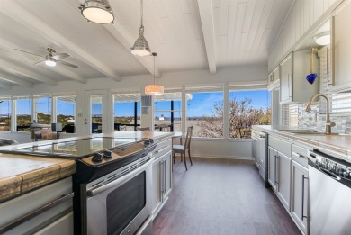 This beautiful hilltop home offers fantastic views of nearby on Apple Rock Golf Course - Horseshoe Bay in Texas - for sale on GolfHomes.com, golf home, golf lot