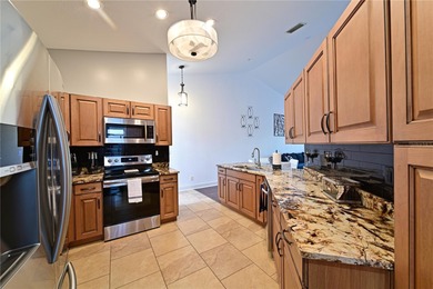 Discover this beautifully maintained TURNKEY 2-story condo on Tara Golf and Country Club in Florida - for sale on GolfHomes.com, golf home, golf lot