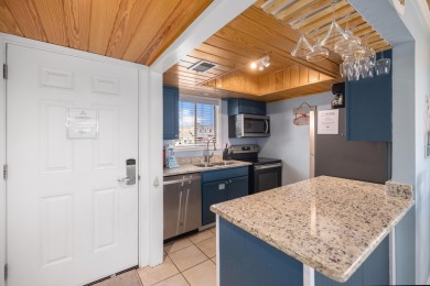 Discover this elegantly appointed second-floor, 2-bedroom on Sandpiper Cove Golf Course in Florida - for sale on GolfHomes.com, golf home, golf lot