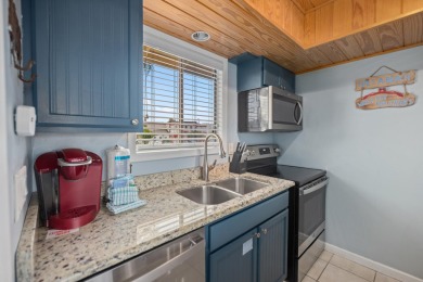 Discover this elegantly appointed second-floor, 2-bedroom on Sandpiper Cove Golf Course in Florida - for sale on GolfHomes.com, golf home, golf lot