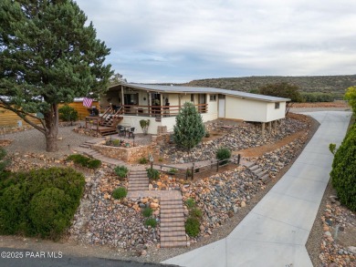Wonderful mountain & sunset views await in this great property! on Prescott Golf and Country Club in Arizona - for sale on GolfHomes.com, golf home, golf lot