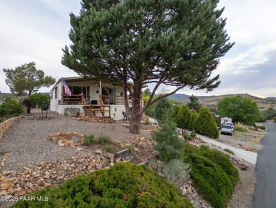 Wonderful mountain & sunset views await in this great property! on Prescott Golf and Country Club in Arizona - for sale on GolfHomes.com, golf home, golf lot