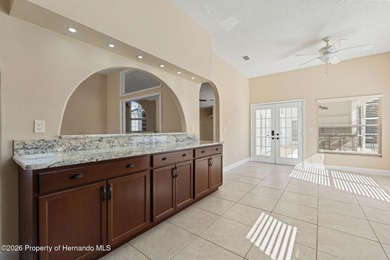 Welcome home to this beautiful Lindhorst-built pool home on Glen Lakes Country Club in Florida - for sale on GolfHomes.com, golf home, golf lot