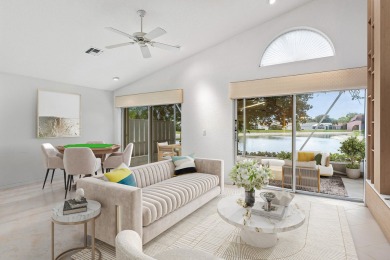 Lakefront single family home nestled amongst vibrant flowering on Westchester Golf and Country Club in Florida - for sale on GolfHomes.com, golf home, golf lot