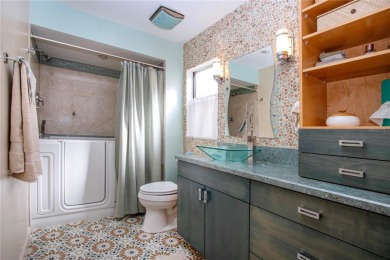 Wow. Don't miss this stylish, serene villa in Sarasota's 55+ on Village Green Golf Club of Sarasota in Florida - for sale on GolfHomes.com, golf home, golf lot