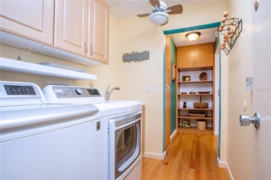 Wow. Don't miss this stylish, serene villa in Sarasota's 55+ on Village Green Golf Club of Sarasota in Florida - for sale on GolfHomes.com, golf home, golf lot