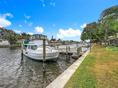 This Mariner Pass unit lives up to its name with a deep-water on Mangrove Bay Golf Course in Florida - for sale on GolfHomes.com, golf home, golf lot