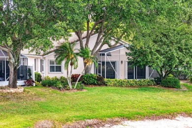 Lakefront single family home nestled amongst vibrant flowering on Westchester Golf and Country Club in Florida - for sale on GolfHomes.com, golf home, golf lot