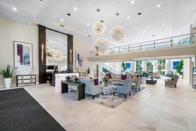 Lakefront single family home nestled amongst vibrant flowering on Westchester Golf and Country Club in Florida - for sale on GolfHomes.com, golf home, golf lot