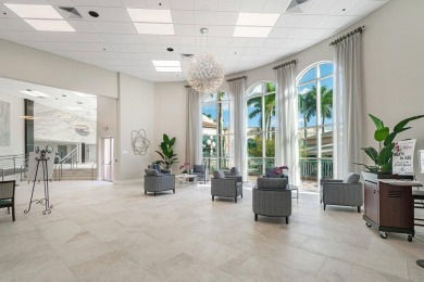 Lakefront single family home nestled amongst vibrant flowering on Westchester Golf and Country Club in Florida - for sale on GolfHomes.com, golf home, golf lot
