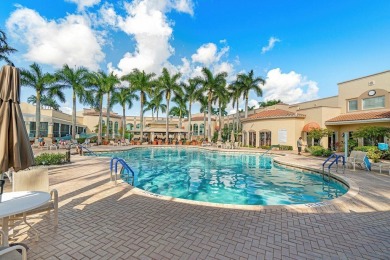 Lakefront single family home nestled amongst vibrant flowering on Westchester Golf and Country Club in Florida - for sale on GolfHomes.com, golf home, golf lot