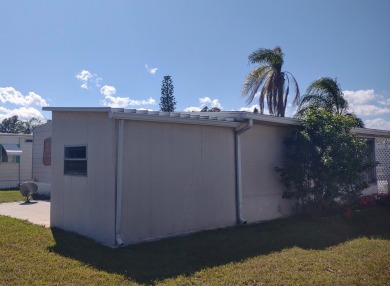 This lovely two bedroom two bathroom manufactured home in the 55 on Spanish Lakes Golf Village in Florida - for sale on GolfHomes.com, golf home, golf lot