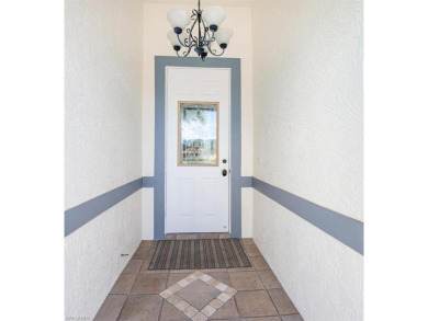 In addition to the 1,630 s/f under air, this attractive 2BR/2BA on Riviera Golf Club in Florida - for sale on GolfHomes.com, golf home, golf lot