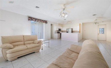 In addition to the 1,630 s/f under air, this attractive 2BR/2BA on Riviera Golf Club in Florida - for sale on GolfHomes.com, golf home, golf lot