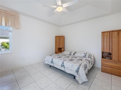 In addition to the 1,630 s/f under air, this attractive 2BR/2BA on Riviera Golf Club in Florida - for sale on GolfHomes.com, golf home, golf lot