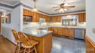 Custom-built home on the 16th green of top-rated Timberstone on TimberStone At Pine Mountain in Michigan - for sale on GolfHomes.com, golf home, golf lot