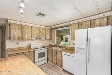 This spacious home features a SPLIT floorplan w/ 3 BEDROOMS & 2 on Sun Lakes Country Club in Arizona - for sale on GolfHomes.com, golf home, golf lot