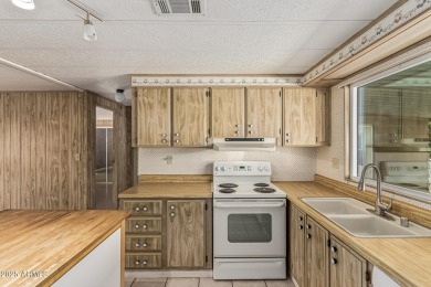 This spacious home features a SPLIT floorplan w/ 3 BEDROOMS & 2 on Sun Lakes Country Club in Arizona - for sale on GolfHomes.com, golf home, golf lot