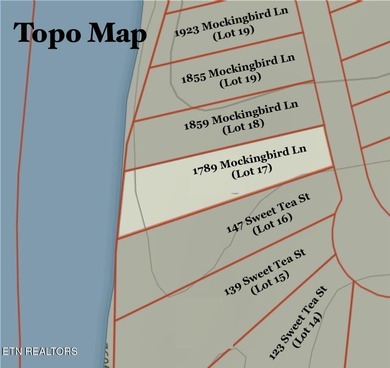 Lot 17 overlooks Watts Bar Lake in the prestigious Tennessee on Tennessee National Golf Club in Tennessee - for sale on GolfHomes.com, golf home, golf lot