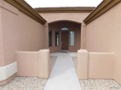 Home is located on a large lot. New interior paint, ceiling fans on Laughlin Ranch Golf Club in Arizona - for sale on GolfHomes.com, golf home, golf lot