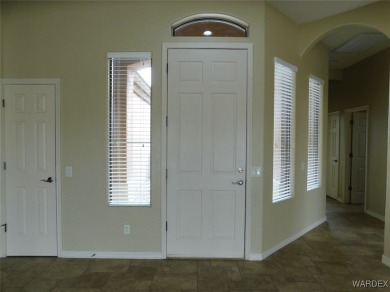Home is located on a large lot. New interior paint, ceiling fans on Laughlin Ranch Golf Club in Arizona - for sale on GolfHomes.com, golf home, golf lot