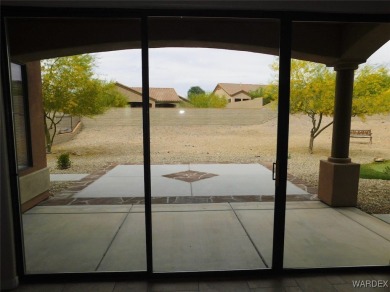 Home is located on a large lot. New interior paint, ceiling fans on Laughlin Ranch Golf Club in Arizona - for sale on GolfHomes.com, golf home, golf lot