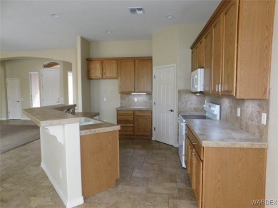 Home is located on a large lot. New interior paint, ceiling fans on Laughlin Ranch Golf Club in Arizona - for sale on GolfHomes.com, golf home, golf lot