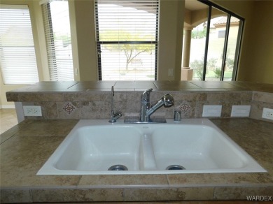 Home is located on a large lot. New interior paint, ceiling fans on Laughlin Ranch Golf Club in Arizona - for sale on GolfHomes.com, golf home, golf lot