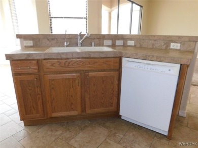 Home is located on a large lot. New interior paint, ceiling fans on Laughlin Ranch Golf Club in Arizona - for sale on GolfHomes.com, golf home, golf lot