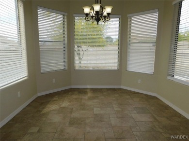 Home is located on a large lot. New interior paint, ceiling fans on Laughlin Ranch Golf Club in Arizona - for sale on GolfHomes.com, golf home, golf lot