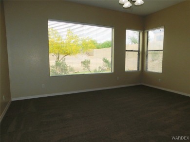 Home is located on a large lot. New interior paint, ceiling fans on Laughlin Ranch Golf Club in Arizona - for sale on GolfHomes.com, golf home, golf lot