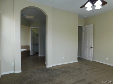 Home is located on a large lot. New interior paint, ceiling fans on Laughlin Ranch Golf Club in Arizona - for sale on GolfHomes.com, golf home, golf lot