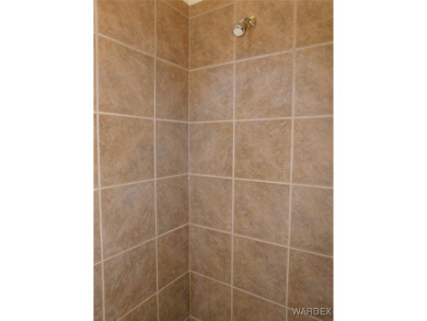 Home is located on a large lot. New interior paint, ceiling fans on Laughlin Ranch Golf Club in Arizona - for sale on GolfHomes.com, golf home, golf lot