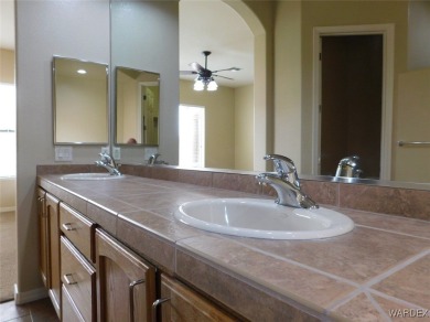 Home is located on a large lot. New interior paint, ceiling fans on Laughlin Ranch Golf Club in Arizona - for sale on GolfHomes.com, golf home, golf lot
