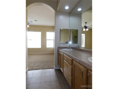 Home is located on a large lot. New interior paint, ceiling fans on Laughlin Ranch Golf Club in Arizona - for sale on GolfHomes.com, golf home, golf lot