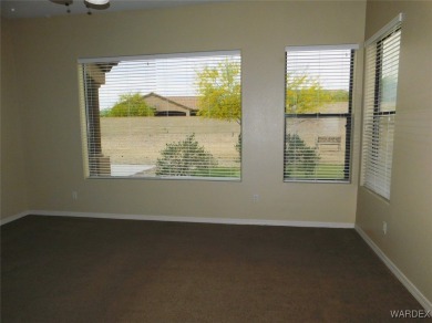 Home is located on a large lot. New interior paint, ceiling fans on Laughlin Ranch Golf Club in Arizona - for sale on GolfHomes.com, golf home, golf lot