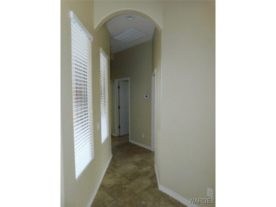 Home is located on a large lot. New interior paint, ceiling fans on Laughlin Ranch Golf Club in Arizona - for sale on GolfHomes.com, golf home, golf lot